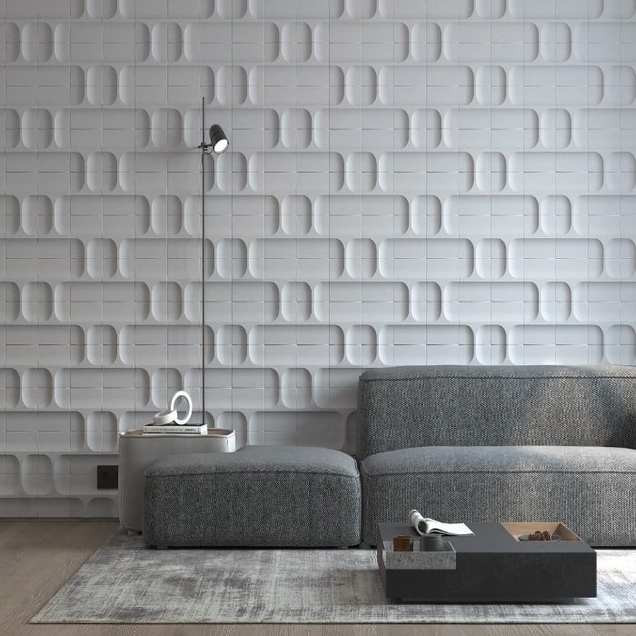 sofa salon y un muro blanco